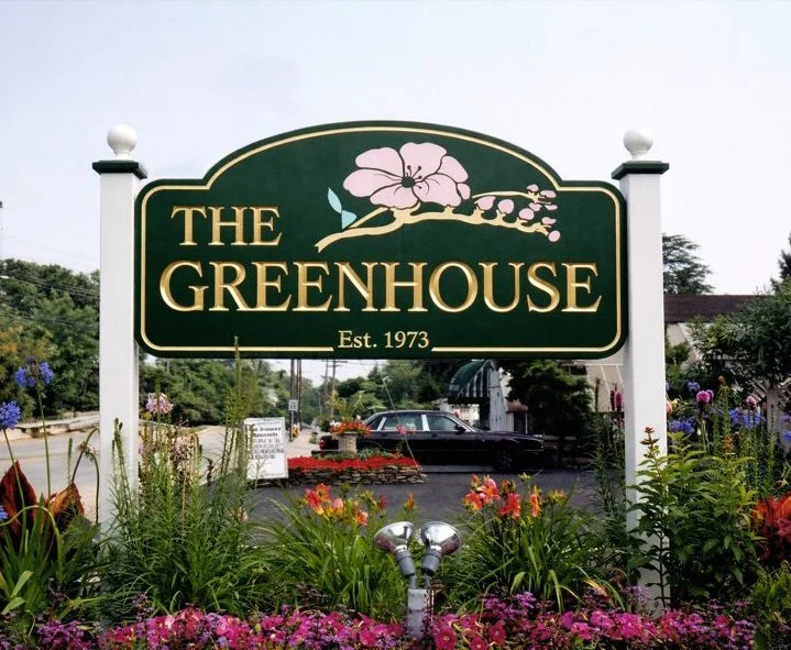 Custom carved wood storefront sign for The Greenhouse — designed and crafted by Frenchtown Signs in Frenchtown, NJ