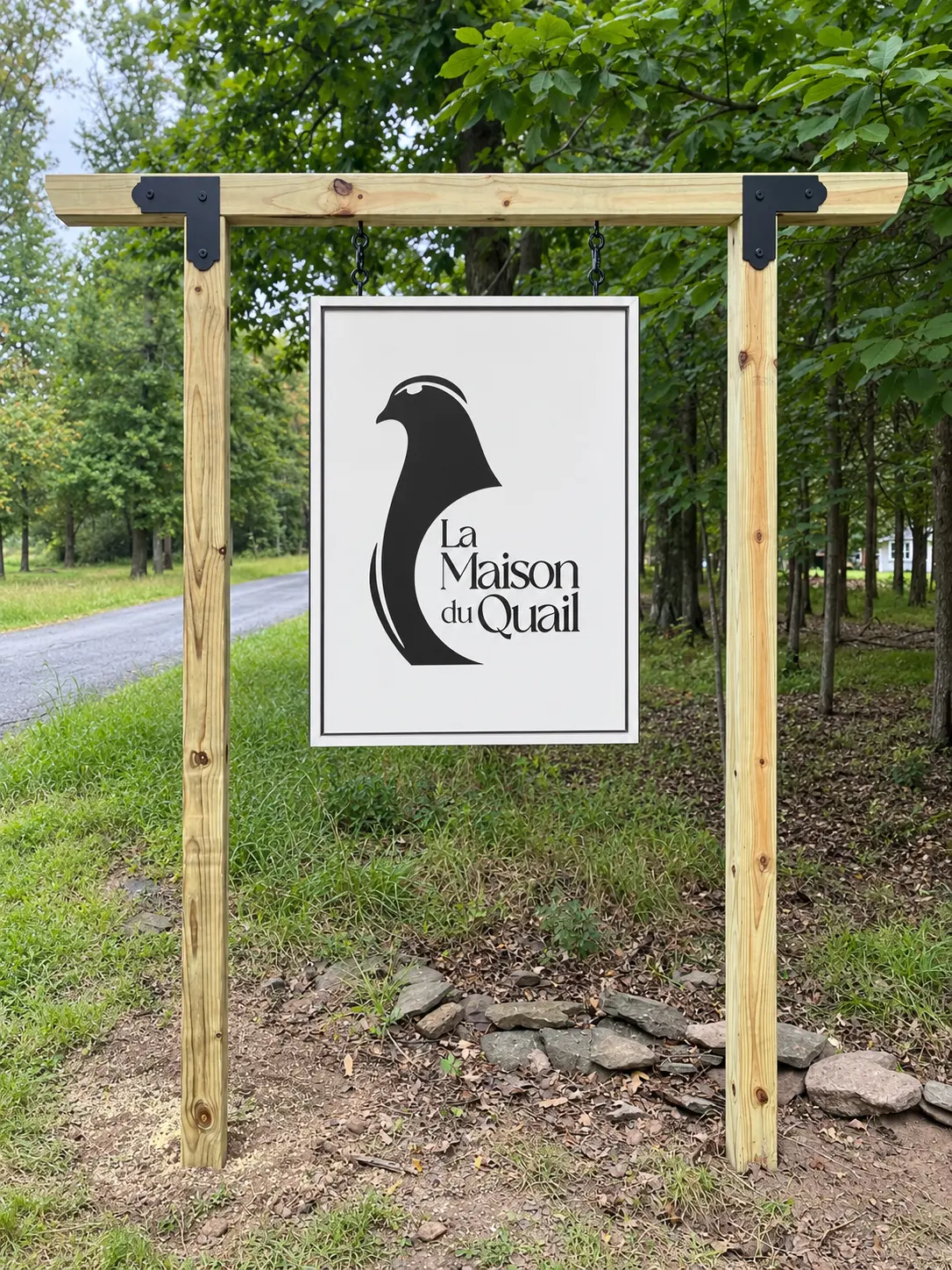 Custom hanging wooden post sign for La Maison du Quail — designed and crafted by Frenchtown Signs in Frenchtown, NJ