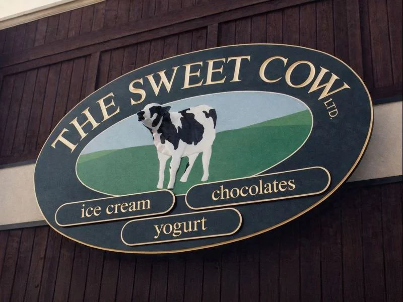 Custom hand-painted shop sign for The Sweet Cow — designed and crafted by Frenchtown Signs in Frenchtown, NJ