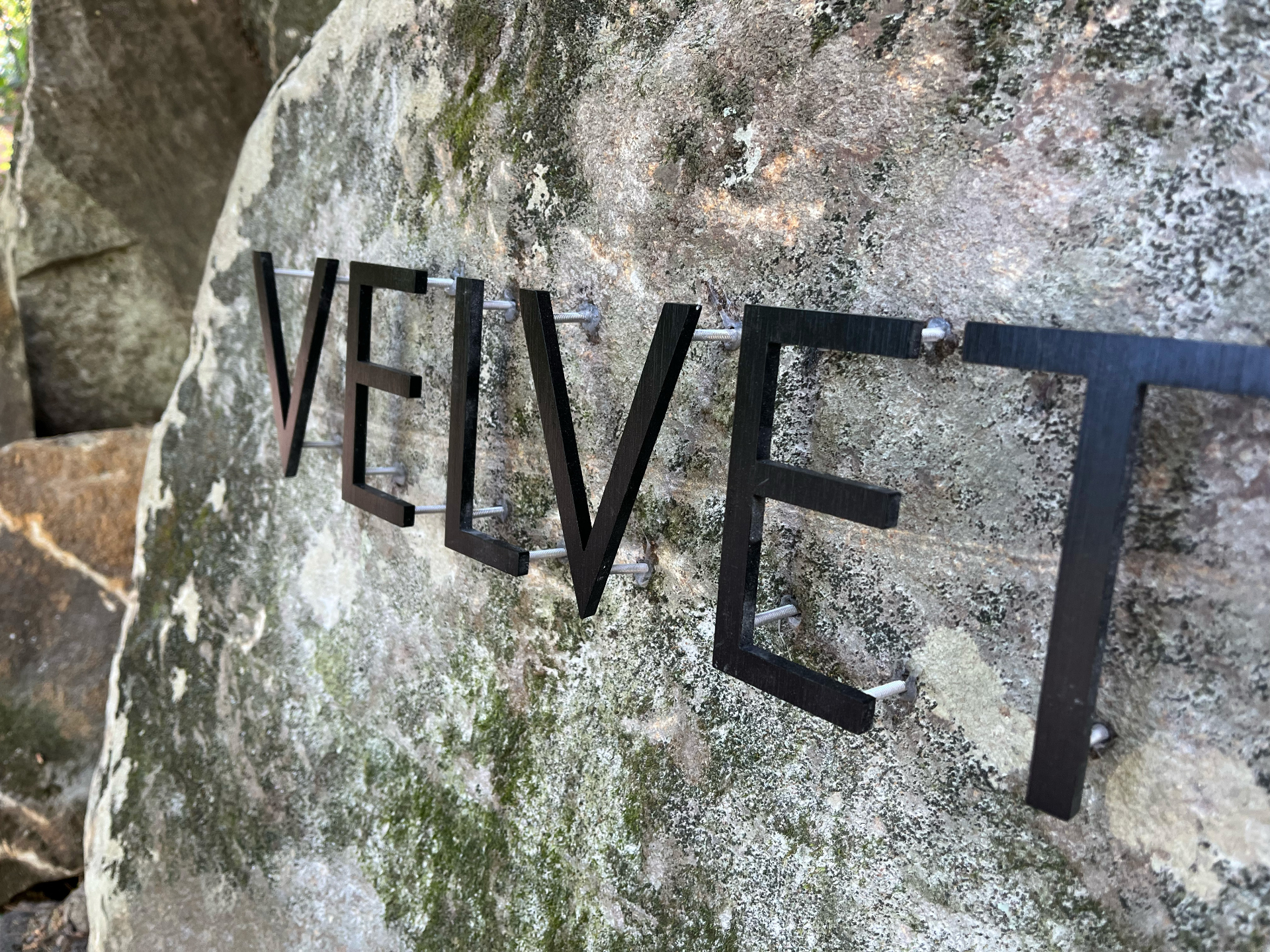 Custom fabricated metal business sign for Velvet Stone — designed and crafted by Frenchtown Signs in Frenchtown, NJ