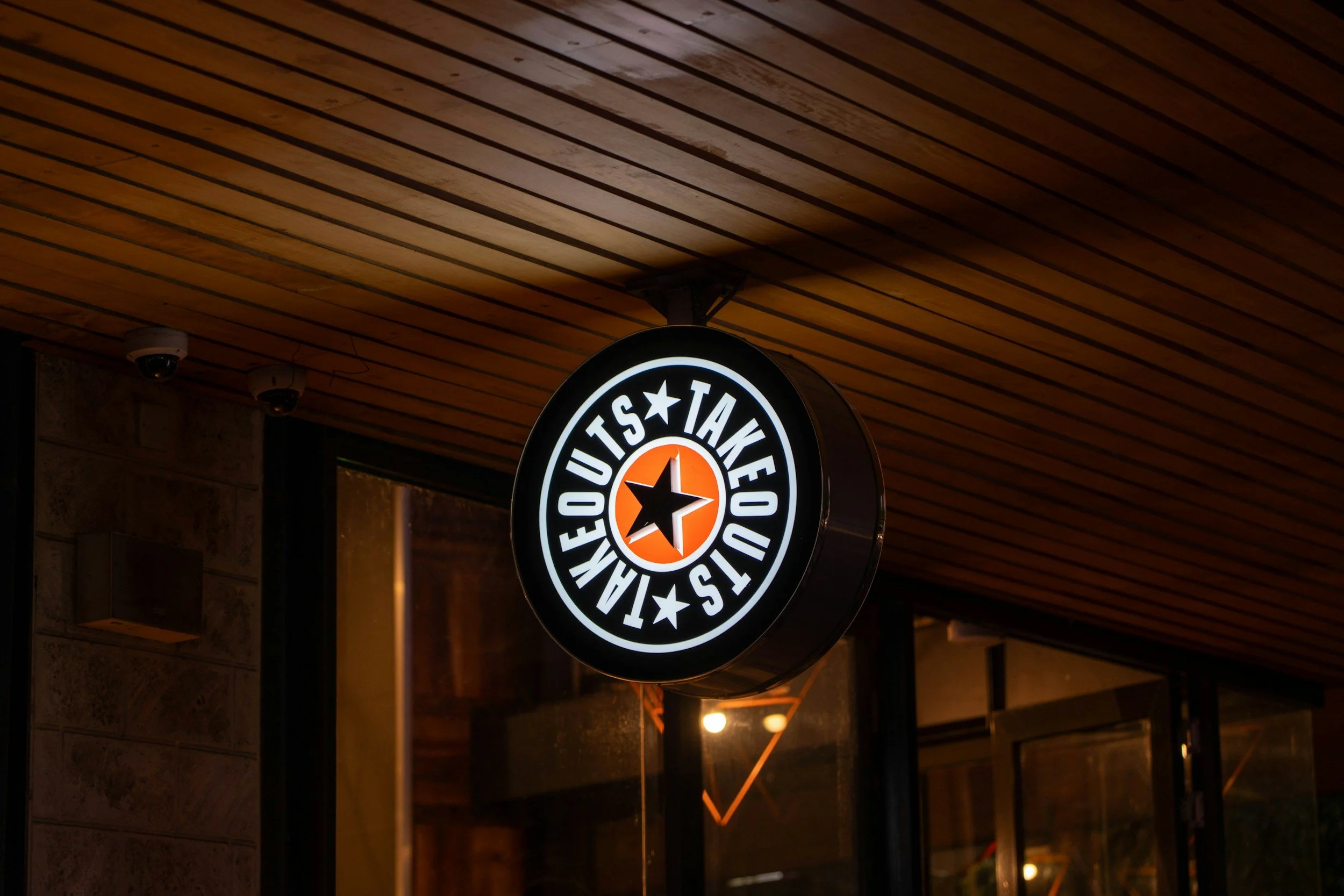 LED halo-lit illuminated business sign glowing at dusk, custom built by Frenchtown Signs